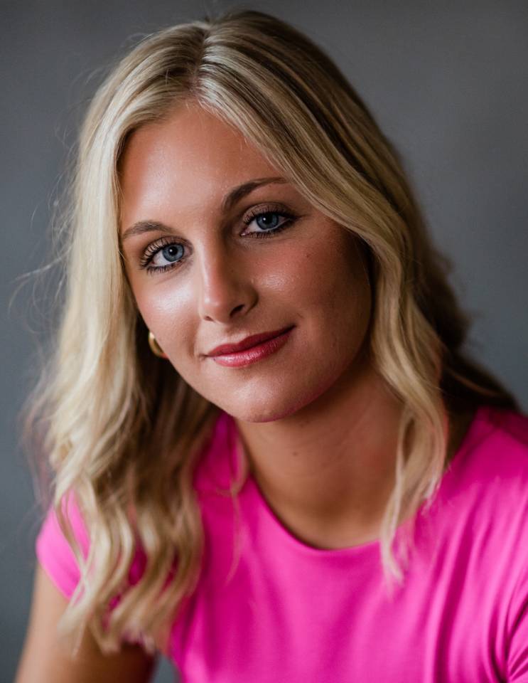 a woman wearing a purple shirt