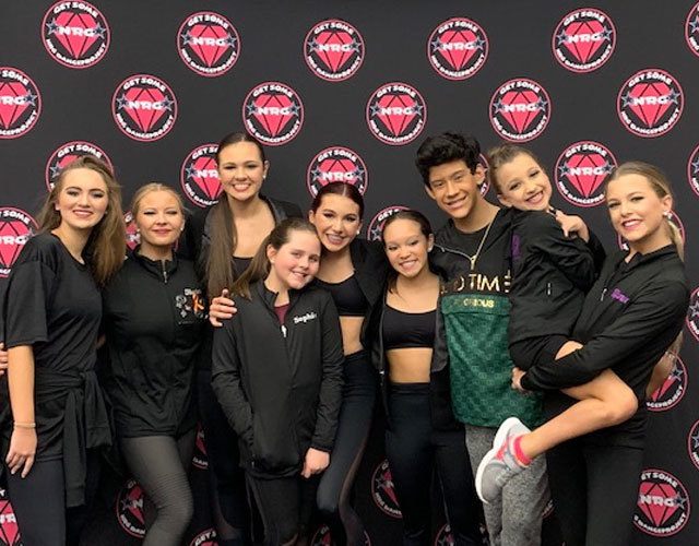 a group of people posing for a photo