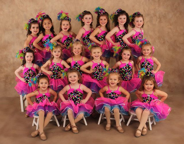 a group of kids posing for a photo