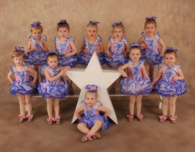 a group of kids posing for a picture