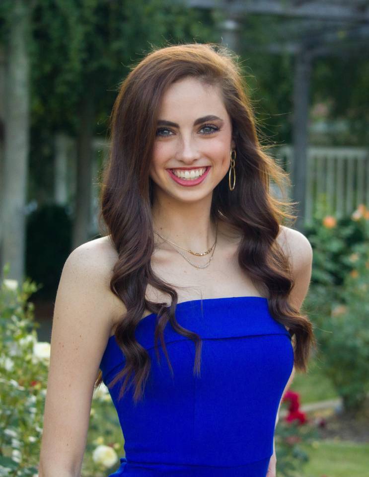 a woman wearing a blue dress